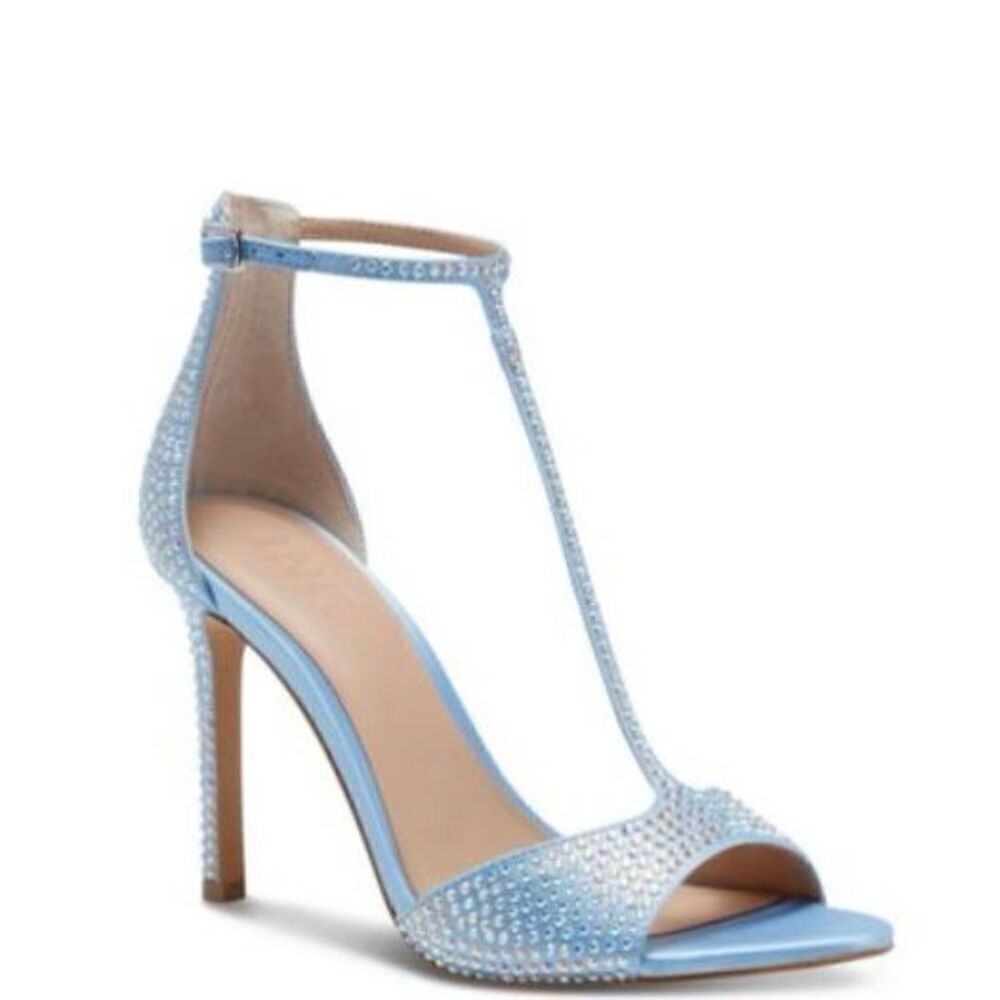 Subtle sparkle tops elegant T-straps and a gorgeous lift in the Firah sandals fr